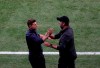 Tottenham coach Mauricio Pochettino, left, shakes hands with Liverpool coach Juergen Klopp at the end of the Champions League final soccer match between Tottenham Hotspur and Liverpool at the Wanda Metropolitano Stadium in Madrid, Saturday, June 1, 2019. (AP Photo/Armando Franca)