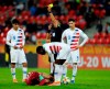 Referee Abdelkader Zitouni shows a yellow card to United States' Alex Mendez, left, during the Group D U20 World Cup soccer match between USA and Qatar, in Tychy, Poland, Thursday, May 30, 2019. (AP Photo/Sergei Grits)