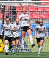 Germany's Giulia Gwinn, center, celebrates with teammates after scoring her side's first goal during the Women's World Cup Group B soccer match between Germany and China, at the Roazhon Park stadium, in Rennes, France, Saturday, June 8, 2019. (AP Photo/David Vincent)