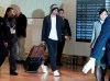 Seattle Mariners' Ichiro Suzuki, center, walks upon his team's arrival at Haneda international airport in Tokyo Friday, March 15, 2019. The Mariners will play in a two-baseball game series against the Oakland Athletics to open the Major League season on March 20-21 at the Tokyo Dome. (AP Photo/Eugene Hoshiko)