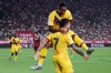 FC Barcelona's Charles Perez, bottom, cerebrates his teammate Malcom after scoring a goal during a friendly soccer match between FC Barcelona and Vissel Kobe at Noevir Stadium in Kobe, western Japan, Saturday, July 27, 2019. (AP Photo/Eugene Hoshiko)