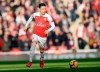 Arsenal's Mesut Ozil challenge for the ball during the English Premier League soccer match between Arsenal and Burnley at the Emirates Stadium in London, Saturday, Dec. 22, 2018. (AP Photo/Tim Ireland)