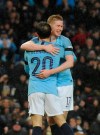 Manchester City's Bernardo Silva and Manchester City's Kevin De Bruyne celebrate after scoring their side's opening goal during the English Premier League soccer match between Manchester City and Burnley at Etihad stadium in Manchester, England, Saturday, Jan. 26, 2019. (AP Photo/Rui Vieira)