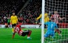 Sheffield United's Lys Moussett, left, scores the opening goal during the English Premier League soccer match between Sheffield United and Arsenal at Bramall Lane in Sheffield, England, Monday, Oct. 21, 2019. (AP Photo/Rui Vieira)