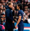 PSG coach Thomas Tuchel and PSG's Edinson Cavani speak during the French League One soccer match between Paris Saint-Germain and Bordeaux at the Parc des Princes stadium in Paris, Saturday, Feb. 9, 2019. (AP Photo/Christophe Ena)