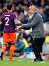 Manchester City coach Pep Guardiola gestures during the Champions League, round of 8, first-leg soccer match between Tottenham Hotspur and Manchester City at the Tottenham Hotspur stadium in London, Tuesday, April 9, 2019. (AP Photo/Frank Augstein)