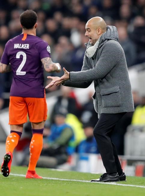 Manchester City coach Pep Guardiola gestures during the Champions League, round of 8, first-leg soccer match between Tottenham Hotspur and Manchester City at the Tottenham Hotspur stadium in London, Tuesday, April 9, 2019. (AP Photo/Frank Augstein)