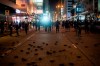 Riot police chase protesters near a demonstration in Hong Kong, Monday, Oct. 7, 2019. Tens of thousands of masked protesters marched defiantly in the city center Sunday, but the peaceful rallies quickly degenerated into chaos at several locations as hard-liners again lobbed gasoline bombs, started fires and trashed subway stations and China-linked banks and shops.(AP Photo/Felipe Dana)