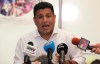 Venezuela Sports Minister Pedro Infante speaks during a news conference from his office in Caracas, Venezuela, Saturday, Jan. 26, 2019. Infante announced that Venezuela will go ahead with an upcoming international baseball tournament in Barquisimeto despite safety concerns stemming from anti-government unrest that has roiled the nation in the past week. (AP Photo/Boris Vergara)