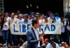 Members of Venezuelan National Assembly holds a sign that reads in Spanish 