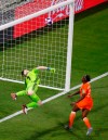 Netherlands' Vivianne Miedema, unseen in the picture, takes the bar as Sweden goalkeeper Hedvig Lindahl jumps during the Women's World Cup semifinal soccer match between the Netherlands and Sweden, at the Stade de Lyon outside Lyon, France, Wednesday, July 3, 2019. (AP Photo/Francois Mori)