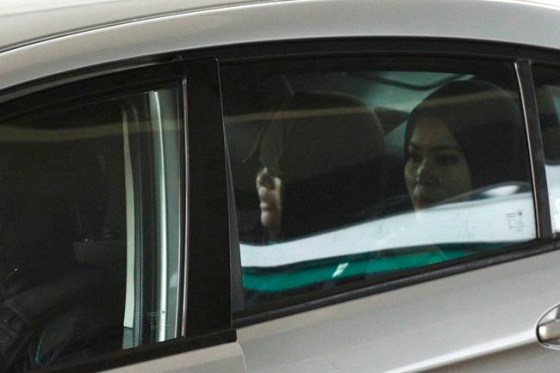 Yam G-Jun / The Associated PressVietnamese Doan Thi Huong, left, is escorted by police as she arrives at Shah Alam High Court in Shah Alam, Malaysia, Monday, March 11, 2019. The trial of two Southeast Asian women charged with murdering Kim Jong Nam, North Korean leader's half brother resumed Monday after months of delay, with the Vietnamese suspect taking the stand to begin her defense. (AP Photo/Yam G-Jun)