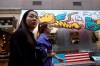 Consumers past by a U.S. fashion apparel store in Beijing Monday, May 6, 2019. U.S. President Donald Trump raised pressure on China on Sunday, threatening to hike tariffs on $200 billion worth of Chinese goods in a tweet that sent financial markets swooning. Trump's comments, delivered on Twitter, came as a Chinese delegation was scheduled to resume talks in Washington on Wednesday aimed at resolving a trade war that has shaken investors and cast gloom over the world economy. (AP Photo/Ng Han Guan)