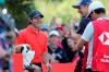 Rory McIlroy of Northern Ireland shares a light moment with Justin Rose of England, second from right, during the HSBC Champions golf tournament held at the Sheshan International Golf Club in Shanghai on Friday, Nov. 1, 2019. (AP Photo/Ng Han Guan) ///