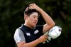 Sungjae Im of South Korea brushes back his hair during the HSBC Champions golf tournament held at the Sheshan International Golf Club in Shanghai on Friday, Nov. 1, 2019. (AP Photo/Ng Han Guan)