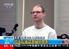 In this image taken from a video footage run by China's CCTV, Canadian Robert Lloyd Schellenberg attends his retrial at the Dalian Intermediate People's Court in Dalian, northeastern China's Liaoning province on Monday, Jan. 14, 2019. (CCTV via AP)