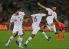 Qatar's midfielder Abdelaziz Hatem, center, celebrates his opening goal with his teammates, during the AFC Asian Cup quarterfinal soccer match between Korea Republic and Qatar at the Zayed Sport City Stadium in Abu Dhabi, United Arab Emirates, Friday, Jan. 25, 2019. (AP Photo/Kamran Jebreili)