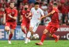 In this photo provided by China's Xinhua News Agency, Wu Lei, center, of China competes during the group A match between China and Syria of the FIFA World Cup Qatar 2022 and AFC Asian Cup China 2023 Preliminary Joint Qualification Round 2 in Dubai, the United Arab Emirates, Thursday, Nov. 14, 2019. China’s football association has pledged to reshuffle the squad and “deeply reflect” following its loss to Syria in a World Cup qualifier that prompted the resignation of coach, Marcello Lippi. (Pan Yulong/Xinhua News Agency via AP)