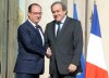 French President Francois Hollande, left, shakes hands with European Soccer Federation UEFA President Michel Platini following their meeting at the Elysee Palace in Paris. France Wednesday, June 10, 2015. (AP Photo/Jacques Brinon)