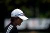 In this Friday, May 24, 2019, photo, Japan women's soccer team head coach Asako Takakura jogs on the field after the team's training session in Narashino, east of Tokyo ahead of the FIFA Women's World Cup France. Takakura went to the Women’s World Cup twice as a player and is first woman in charge, a fact she largely dismisses. But some see it as a breakthrough in a country that has few women in corporate board rooms or in the top ranks of government. (AP Photo/Jae C. Hong)