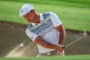 Bryson Dechambeau of the U.S. plays out of a bunker on the 3rd hole during round three of the Dubai Desert Classic golf tournament in Dubai, United Arab Emirates, Saturday, Jan. 26, 2019. (AP Photo/Kamran Jebreili)