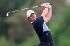 Rory McIlroy of Northern Ireland watches his ball on the 3rd hole during the first round of the DP World Tour Championship golf tournament in Dubai, United Arab Emirates, Thursday, Nov. 21, 2019. (AP Photo/Kamran Jebreili)