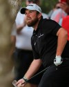 Shane Lowry of Ireland follows his ball on the 2nd hole in the final round of the Abu Dhabi Championship golf tournament in Abu Dhabi, United Arab Emirates, Saturday, Jan. 19, 2019. (AP Photo/Kamran Jebreili)