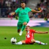 Salzburg's Rasmus Kristensen, right, and Madrid's Eden Hazard challenge for the ball during the friendly soccer match between Red Bull Salzburg and Real Madrid in the Red Bull Arena in Salzburg, Austria, on Wednesday, Aug.7, 2019. (AP Photo/Kerstin Joensson)