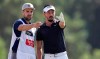Mike Lorenzo-Vera, of France, talks to his caddie on the 3rd hole during the second round of the DP World Tour Championship golf tournament in Dubai, United Arab Emirates, Friday, Nov. 22, 2019. (AP Photo/Kamran Jebreili)