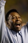 FILE - In this Nov. 19, 2008 file photo, Brazil's soccer great Pele greets supporters prior to a friendly soccer match, in Brasilia, Brazil. A Brazilian hospital says Pele has been transferred to a 