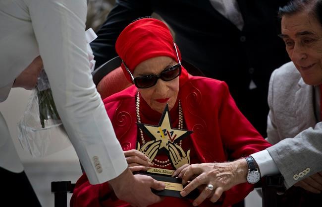 FILE - In this March 20, 2019 file photo, Cuba's Prima Ballerina Alicia Alonso receives the Star of the Century award from the Latin Music Institute in recognition of her contribution to ballet and culture, during a ceremony in Havana, Cuba. Cuba'a national ballet has reported that Alonso has died on Thursday, Oct. 17, 2019. (AP Photo/Ramon Espinosa, File)
