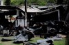 FILE - In this Feb. 8, 2019 file photo, debris from a deadly fire at the Flamengo soccer club training complex litters the ground in Rio de Janeiro, Brazil. An investigators' report of the case obtained by The Associated Press on June 11, 2019 shows the former president of Brazilian soccer club, Eduardo Bandeira de Mello, and seven others were charged for the fire. (AP Photo/Leo Correa, File)