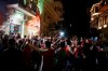 Arsenal supporters stand outside a pub in Baku, Azerbaijan, Tuesday May 28, 2019. English Premier League teams Arsenal and Chelsea are preparing for the Europa League Final soccer match that takes place in Baku on Wednesday night. (AP Photo/ Luca Bruno)