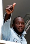 Soccer forward Romelu Lukaku gives his thumbs up as he salutes Inter Milan supporters from a window of the Italian Olympic Committee's headquarters, in Milan,Italy, Thursday, Aug. 8, 2019. Manchester United forward Lukaku is on the verge of completing his move to Inter Milan on the final day of transfers in England. (AP Photo/Luca Bruno)