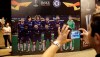 Tourists take pictures in at the fan zone in Baku, Azerbaijan, Tuesday May 28, 2019. English Premier League teams Arsenal and Chelsea are preparing for the Europa League Final soccer match that takes place in Baku on Wednesday night. (AP Photo/ Luca Bruno)