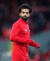 Liverpool's Mohamed Salah warms up prior to the start of the English Premier League soccer match between Liverpool and Manchester City at Anfield stadium in Liverpool, England, Sunday, Nov. 10, 2019. (AP Photo/Jon Super)