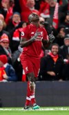 Liverpool forward Sadio Mane celebrates after scoring the opening goal during the English Premier League soccer match between Liverpool and Leicester City, at Anfield Stadium, Liverpool, England, Wednesday, Jan.29, 2019. (AP Photo/Jon Super)