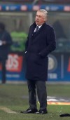 Napoli coach Carlo Ancelotti stands during a Serie A soccer match between Inter Milan and Napoli, at the San Siro stadium in Milan, Italy, Wednesday, Dec.26, 2018. Ancelotti has threatened to lead his team off the pitch the next time one of his players is subject to continued racist abuse. Ancelotti asked several times for Napoli's match at Inter Milan to be halted on Wednesday after racist chanting. Announcements were made on the stadium tannoy system warning fans that would happen but no further action was taken. (AP Photo/Luca Bruno)