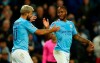 Manchester City's Raheem Sterling, left, celebrates with his teammate Sergio Aguero after scoring his side's fifth goal, during the group C Champions League soccer match between Manchester City and Atalanta at the Etihad Stadium in Manchester, England, Tuesday, Oct. 22, 2019. (AP Photo/Dave Thompson)