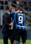 Inter Milan's head coach Antonio Conte hugs Romelu Lukaku after the Serie A soccer match between Inter Milan and Lecce at the San Siro stadium, in Milan, Italy, Monday, Aug. 26, 2019. (AP Photo/Luca Bruno)