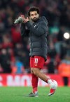 Liverpool's Mohamed Salah applauds at the end of the English Premier League soccer match between Liverpool and Manchester City at Anfield stadium in Liverpool, England, Sunday, Nov. 10, 2019. Liverpool won 3-1. (AP Photo/Jon Super)