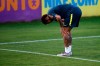 Brazil's soccer player Neymar touches his left knee during a practice session at the Granja Comary training center ahead of the Copa America tournament, in Teresopolis, Brazil, Tuesday, May 28, 2019. (AP Photo/Leo Correa)