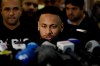 Brazilian soccer player Neymar speaks to journalists as he leaves a police station where he spoke to police in Rio de Janeiro, Brazil, Thursday, June 6, 2019. Rio de Janeiro police said Thursday that soccer star Neymar was expected to testify in the investigation linked to a woman's rape allegation against him. (AP Photo/Leo Correa)