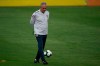 Brazil's national soccer team coach Tite kicks the ball during a practice session at the Granja Comary training center ahead the Copa America tournament in Teresopolis, Brazil, Sunday, June 2, 2019. (AP Photo/Leo Correa)