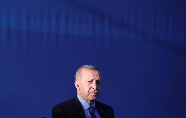 Turkey's President Recep Tayyip Erdogan attends a ceremony to inaugurate a Turkey-financed highway linking Belgrade with Bosnia's capital of Sarajevo in Sremska Raca, some 80 kilometers (49 miles) west of Belgrade, Serbia, during his two-day official visit, Tuesday, Oct. 8, 2019. The White House said Sunday that U.S. forces in northeast Syria will move aside and clear the way for an expected Turkish assault, essentially abandoning Kurdish fighters who fought alongside American forces in the years long battle to defeat Islamic State militants. Erdogan has threatened for months to launch the military operation across the border as he views the Kurdish forces as a threat to his country. (Presidential Press Service via AP, Pool)