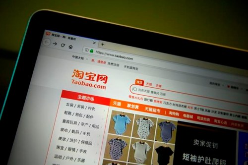 The home page of Chinese e-commerce site Taobao is seen on a computer screen in Beijing, Thursday, April 11, 2019. The mother of a Chinese child model has apologized after videos of her appearing to beat her daughter appeared online, sparking outrage and debate about the country's highly competitive child modeling industry. Internet users identified the child as Niuniu, a 3-year-old girl who models clothes sold on e-commerce website Taobao. (AP Photo/Mark Schiefelbein)