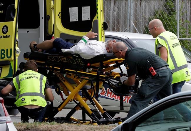 Mark Baker / The Associated Press
Ambulance staff take a man from outside a mosque in central Christchurch, New Zealand, Friday, March 15, 2019. A witness says many people have been killed in a mass shooting at a mosque in the New Zealand city of Christchurch. (AP Photo/Mark Baker)