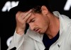 Britain's Andy Murray reacts during a press conference following his first round loss to Spain's Roberto Bautista Agut at the Australian Open tennis championships in Melbourne, Australia, Tuesday, Jan. 15, 2019. (AP Photo/Kin Cheung)