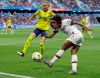 United States' Crystal Dunn, right, kicks the ball as Sweden's Nathalie Bjorn attempts to block the shot during the Women's World Cup Group F soccer match between Sweden and the United States at Stade Océane, in Le Havre, France, Thursday, June 20, 2019. (AP Photo/Alessandra Tarantino)