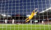 United States goalkeeper Alyssa Naeher is airborne as she makes a save during the Women's World Cup quarterfinal soccer match between France and the United States at Parc des Princes in Paris, France, Friday, June 28, 2019. (AP Photo/Alessandra Tarantino)